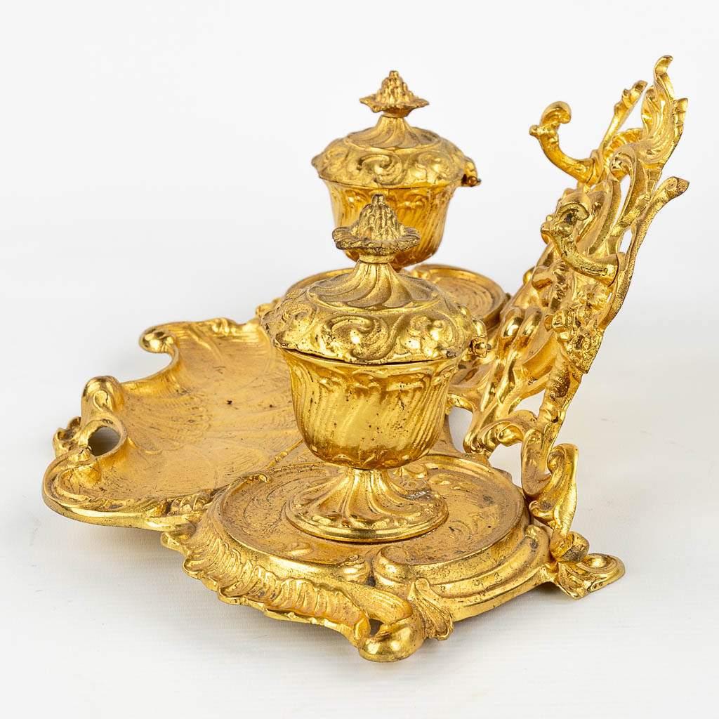 An antique inkwell with 2 pots, decorated with a satyr in Louis XV style and made of bronze. (H:14cm)