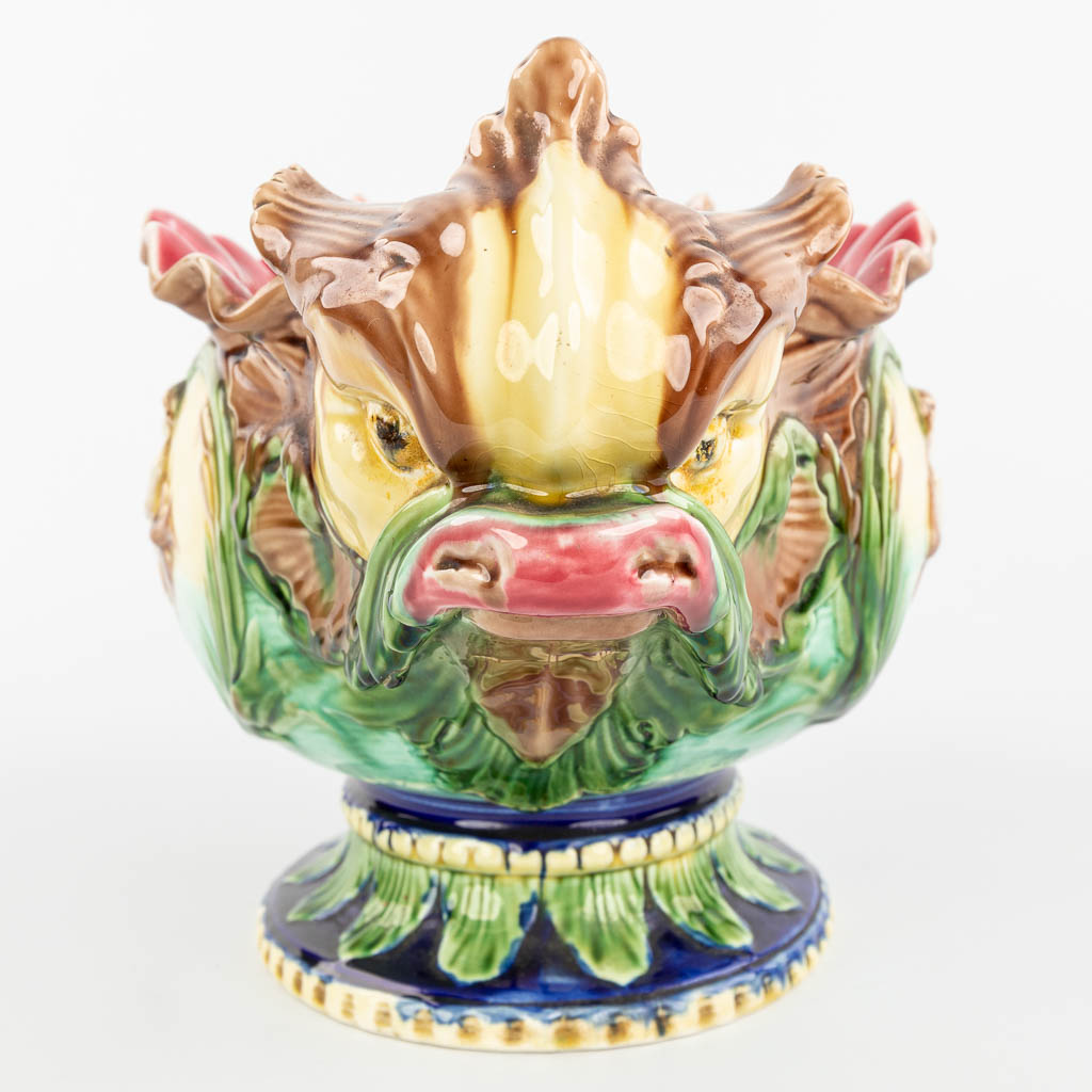 A cache-pot flower pot made of glazed faience in art nouveau style and decorated with putti and fish. (H:26cm)