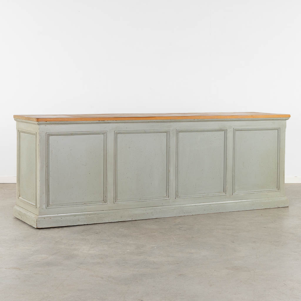A large 'Shop Counter' patinated and oiled wood. 20th C. (L:57 x W:230 x H:80 cm)