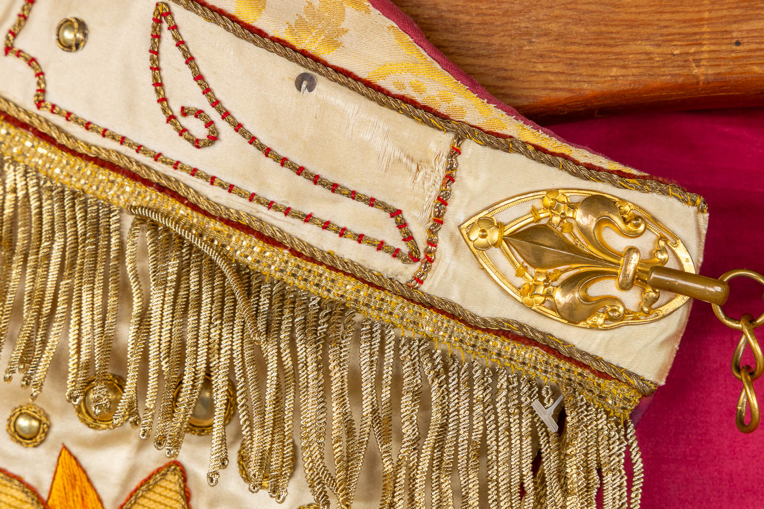 A cope, gold-thread embroideries with an image of Jesus Christ with a sacred heart.  