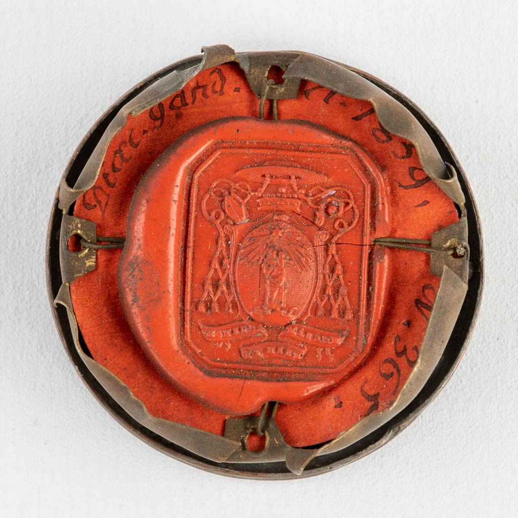 A sealed theca with a relic: Ex Ossibus Sancti Quintii Martyris