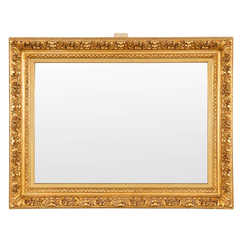 A large mirror, gilt stucco and wood. (W:140 x H:107 cm)