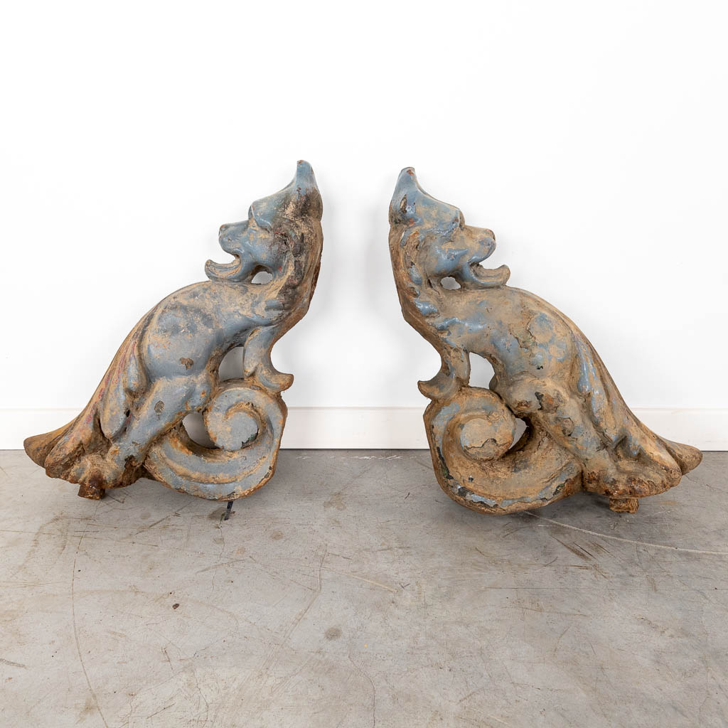 Two 'Chasses-Roues', wall protectors for carriage wheels, patinated cast iron. 19th C. (W:36 x H:47 cm)