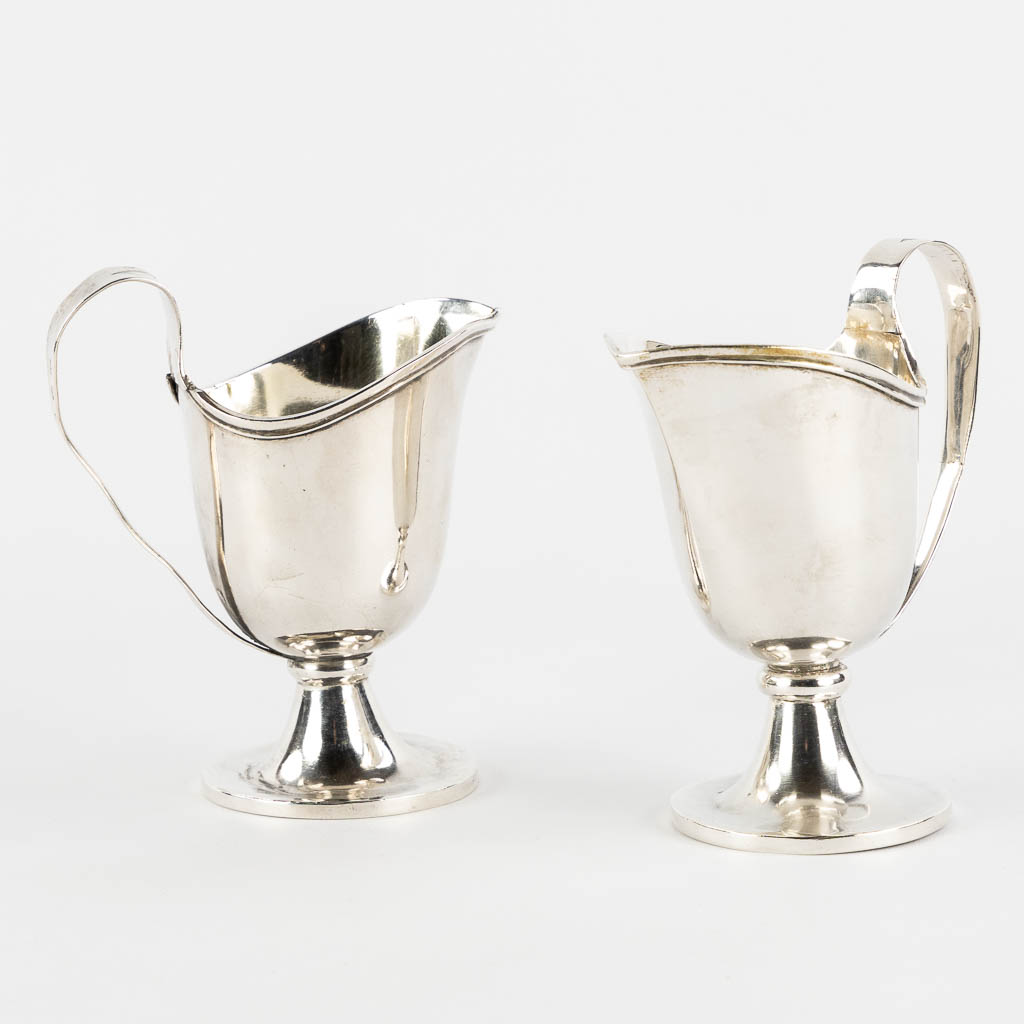 Philippus MYS 1759-1847) A pair of 'Water and Wine Cruets', Vino & Aqua, Silver, Bruges. 19th C. (L:11 x W:6,5 x H