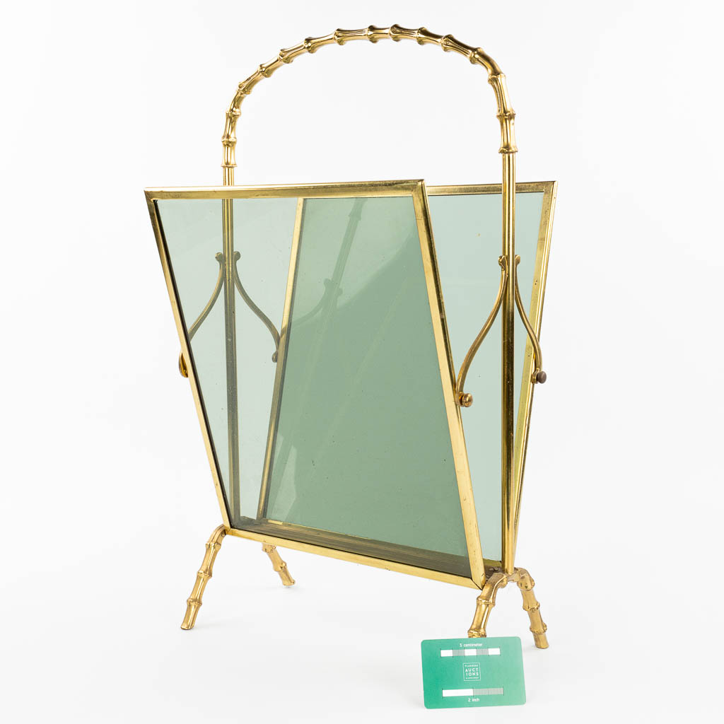 A faux bamboo newspaper holder, brass and glass, in the style of Jacques Adnet. (H:57cm)