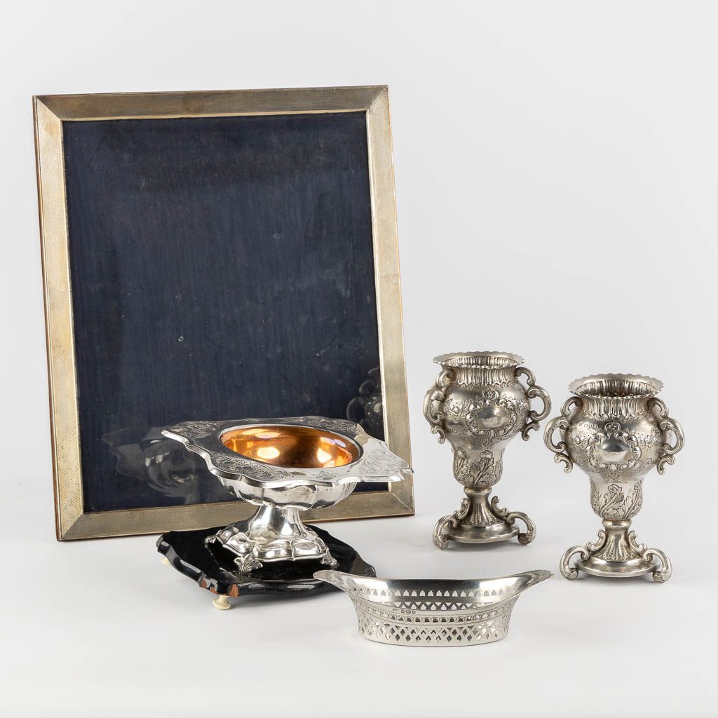 Lot 019 An antique picture frame, added two vases and a basket. Silver, England and Europe. (W:28 x H:34 cm)
