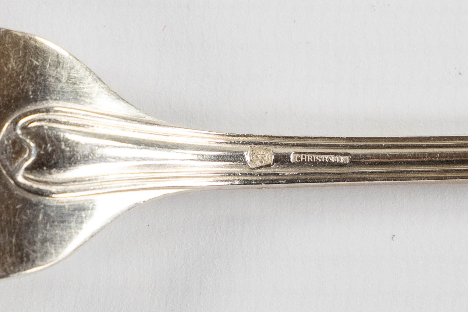 A large collection of silver-plated cutlery, added 12 Delheid silver ice spoons, 309g. 