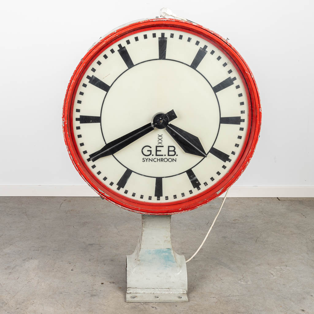 A vintage wall clock 'G.E.B.' voor 'Gemeentelijk Energiebedrijf Amsterdam', the mother clock. (H:110cm)