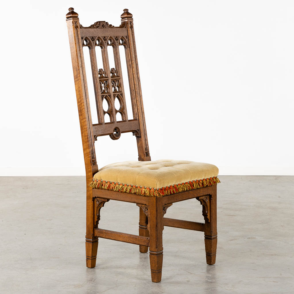 8 Gothic Revival style chairs, sculptured wood. Circa 1900. (L:54 x W:48 x H:123 cm)