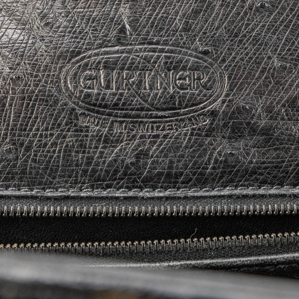 A handbag made of black ostrich leather and made by Olivier Gurtner in Switzerland. (H:28cm)