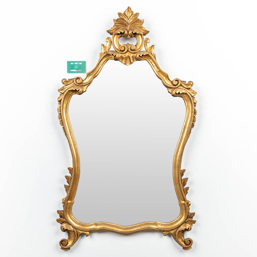 A mirror made of sculptured wood in Louis XV style. (H:109cm)