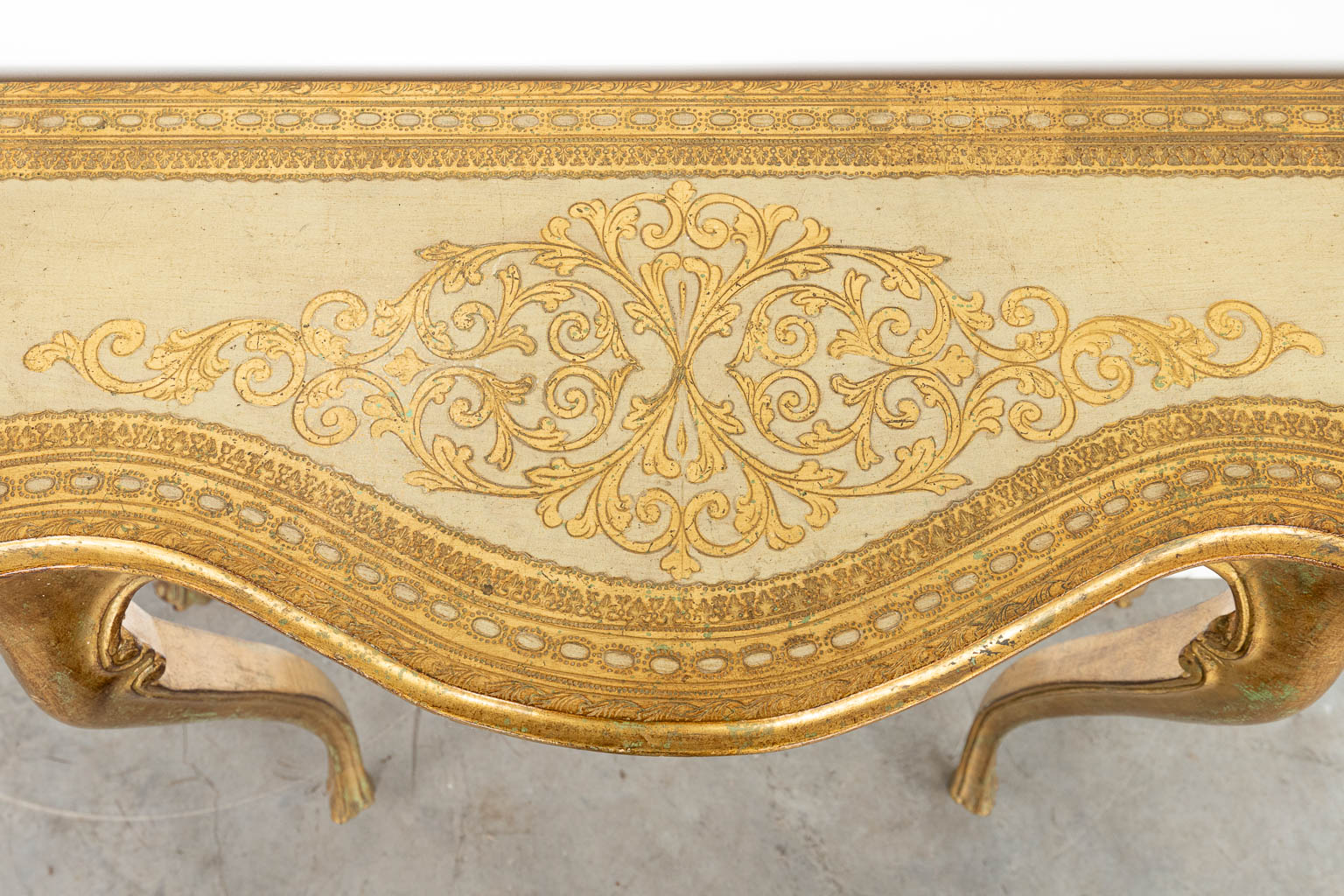 A gilt console table made of wood with stucco. (H:86cm)