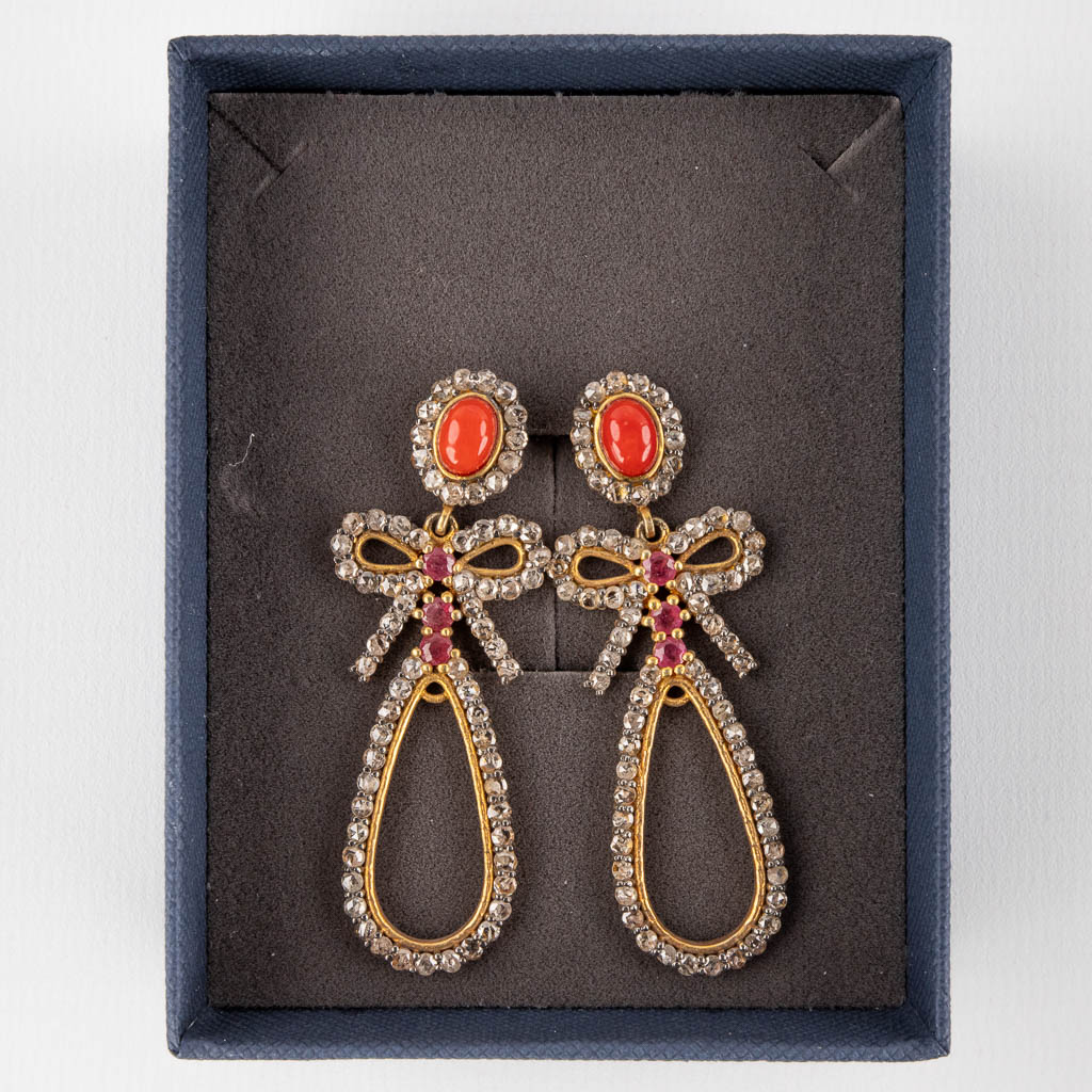 A pair of earrings, gilt silver with coral, ruby and old cut diamonds. 12,10g.