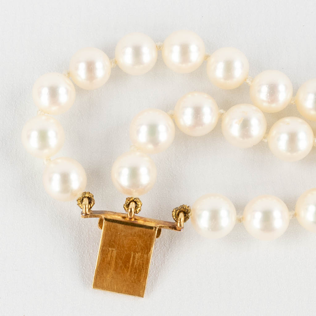 Wolfers Frères, een halsketting, armband, parels en 18kt goud. 20ste eeuw. (D:43 cm)