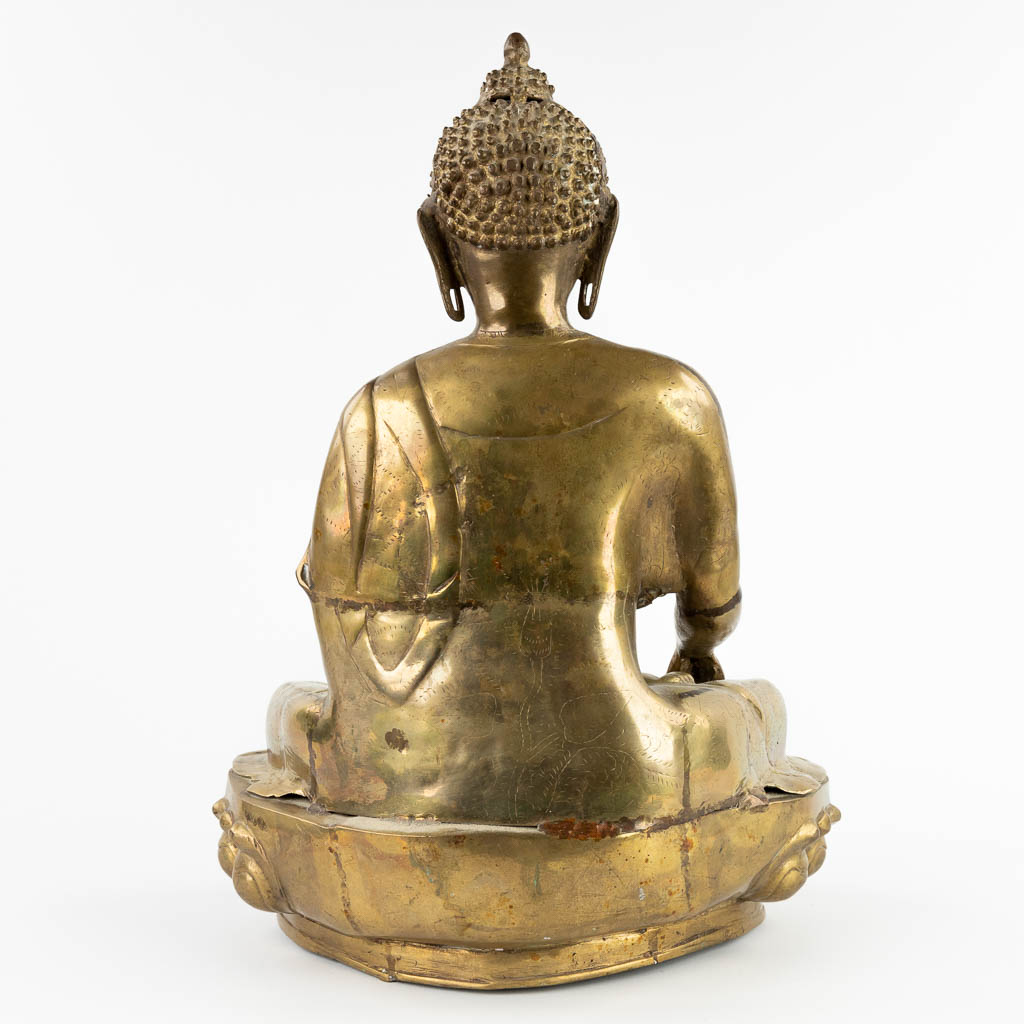 A decorative Thai buddha on a lotus flower, bronze, 20th C. (D:29 x W:42 x H:55 cm)