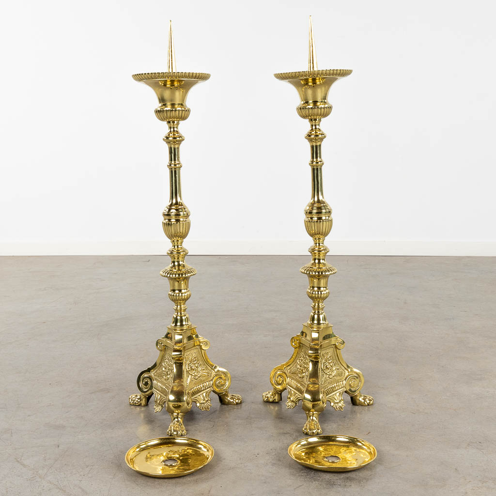 A pair of church candlesticks or candle holders polished bronze. 19th C. (D:24 x W:27 x H:88 cm)