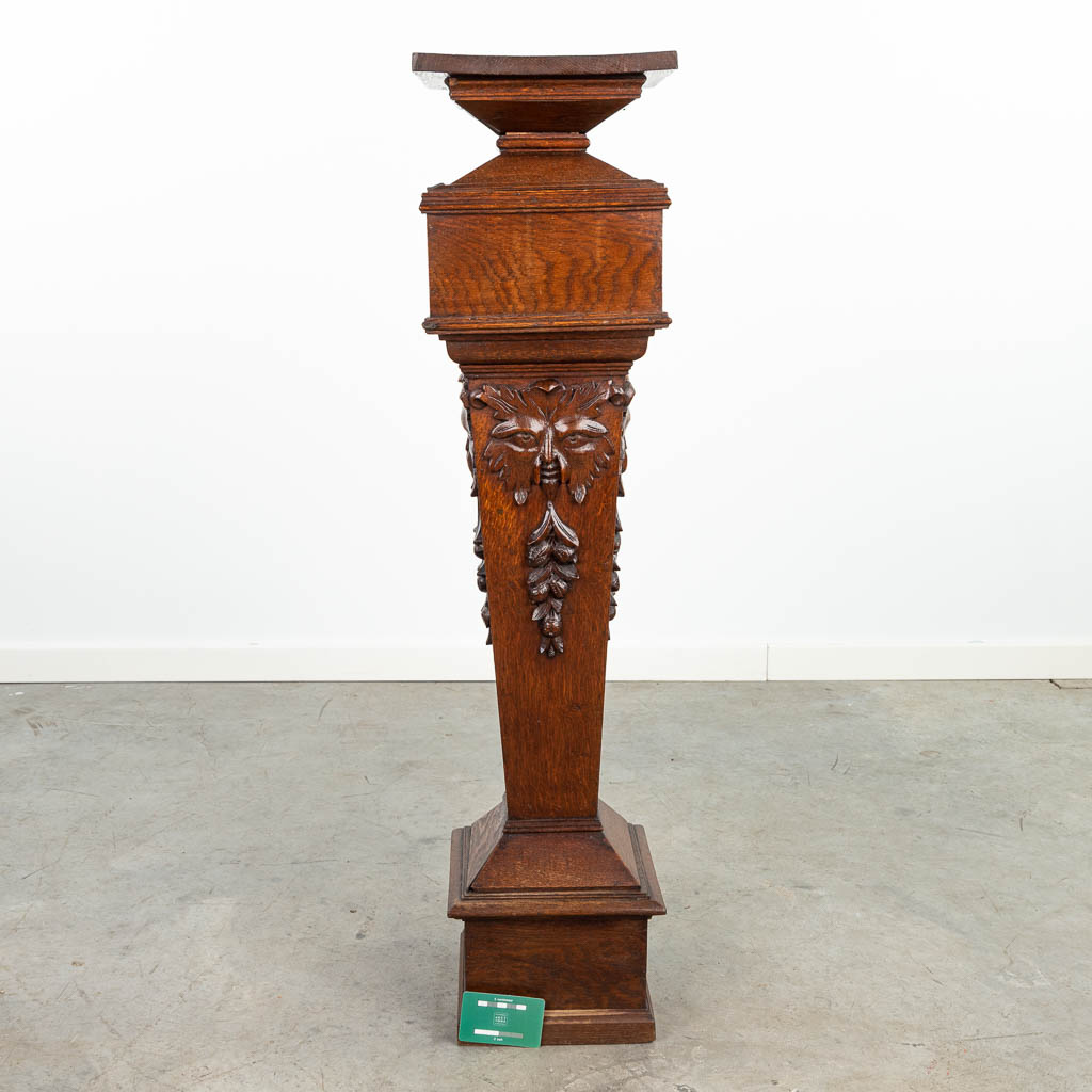 A pedestal made of sculptured wood and finished with mythological figurines. (H:99cm)