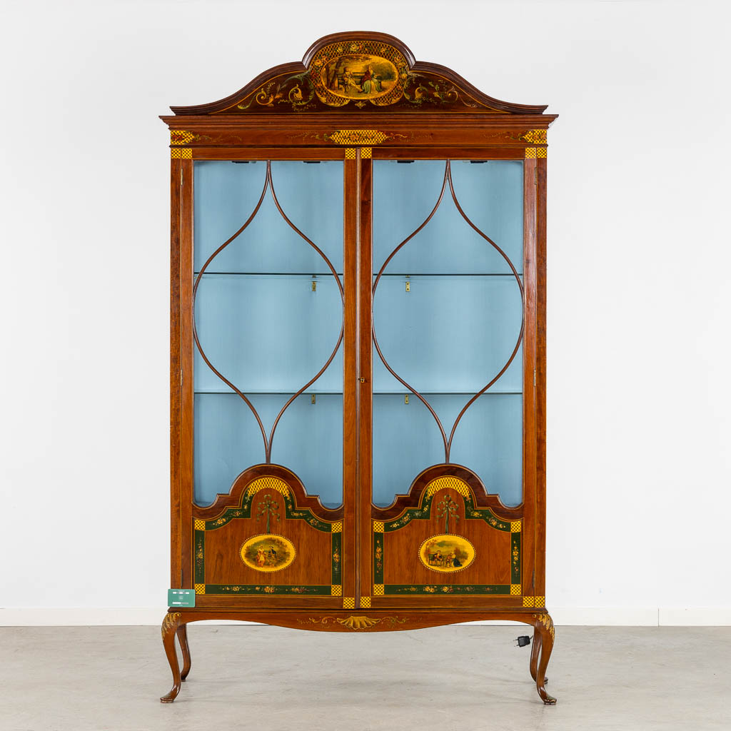 An attractive English display cabinet, hand-painted decors. Circa 1920. (L:39 x W:124 x H:210 cm)