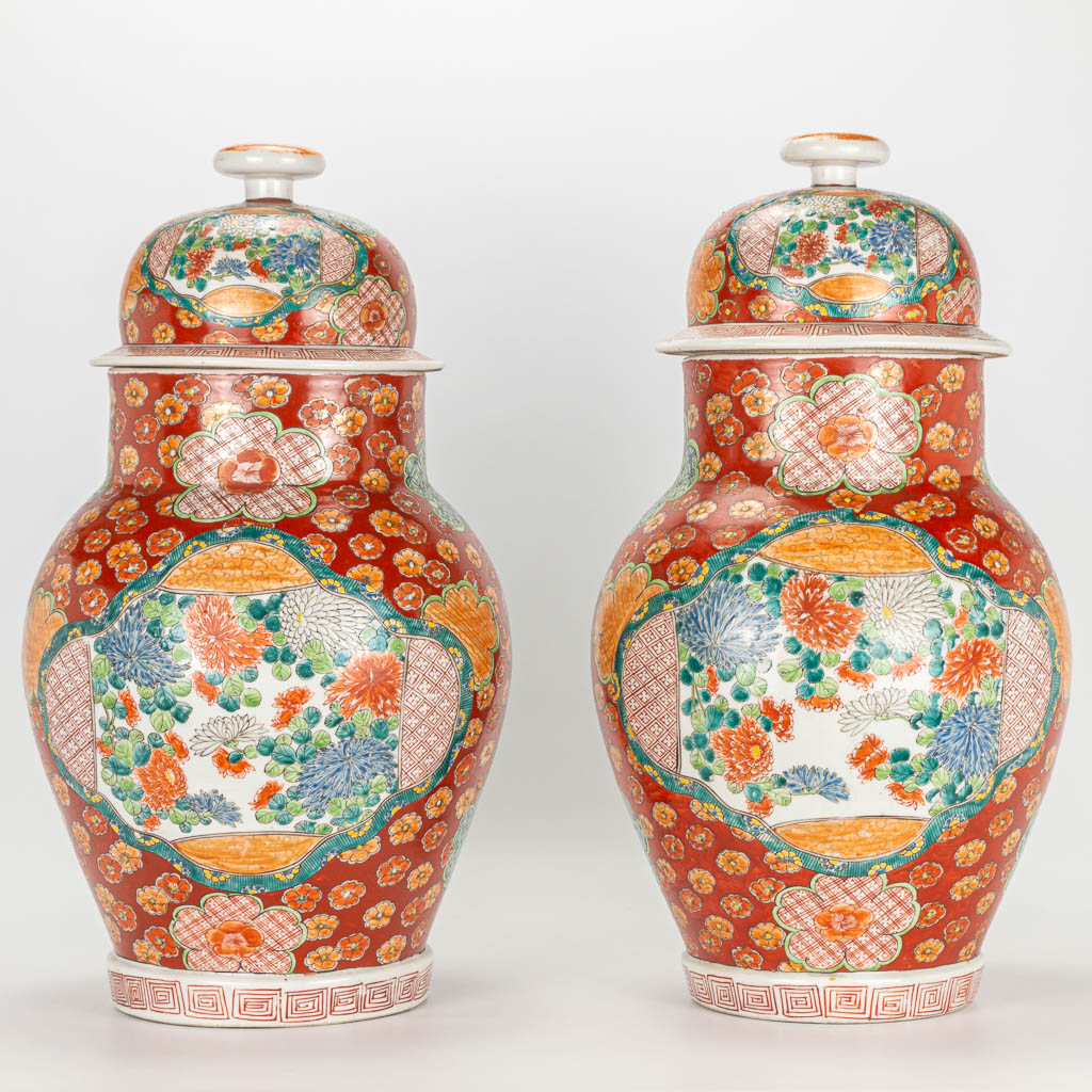 A pair of Japanese Kutani vases with lid.