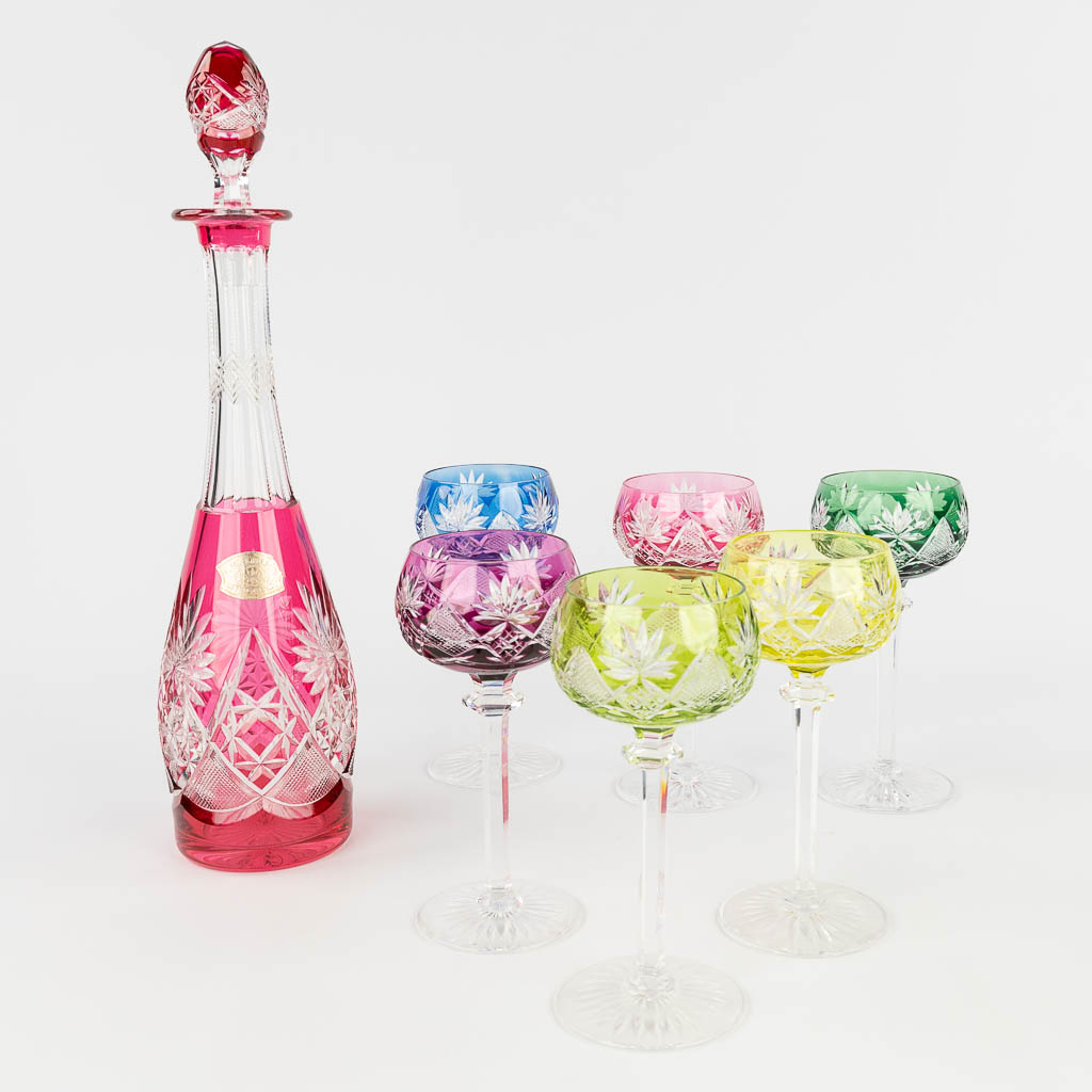 Val Saint Lambert, Berncastel, a collection of 6 coloured and cut crystal glasses with a carafe. (H: 41 cm)