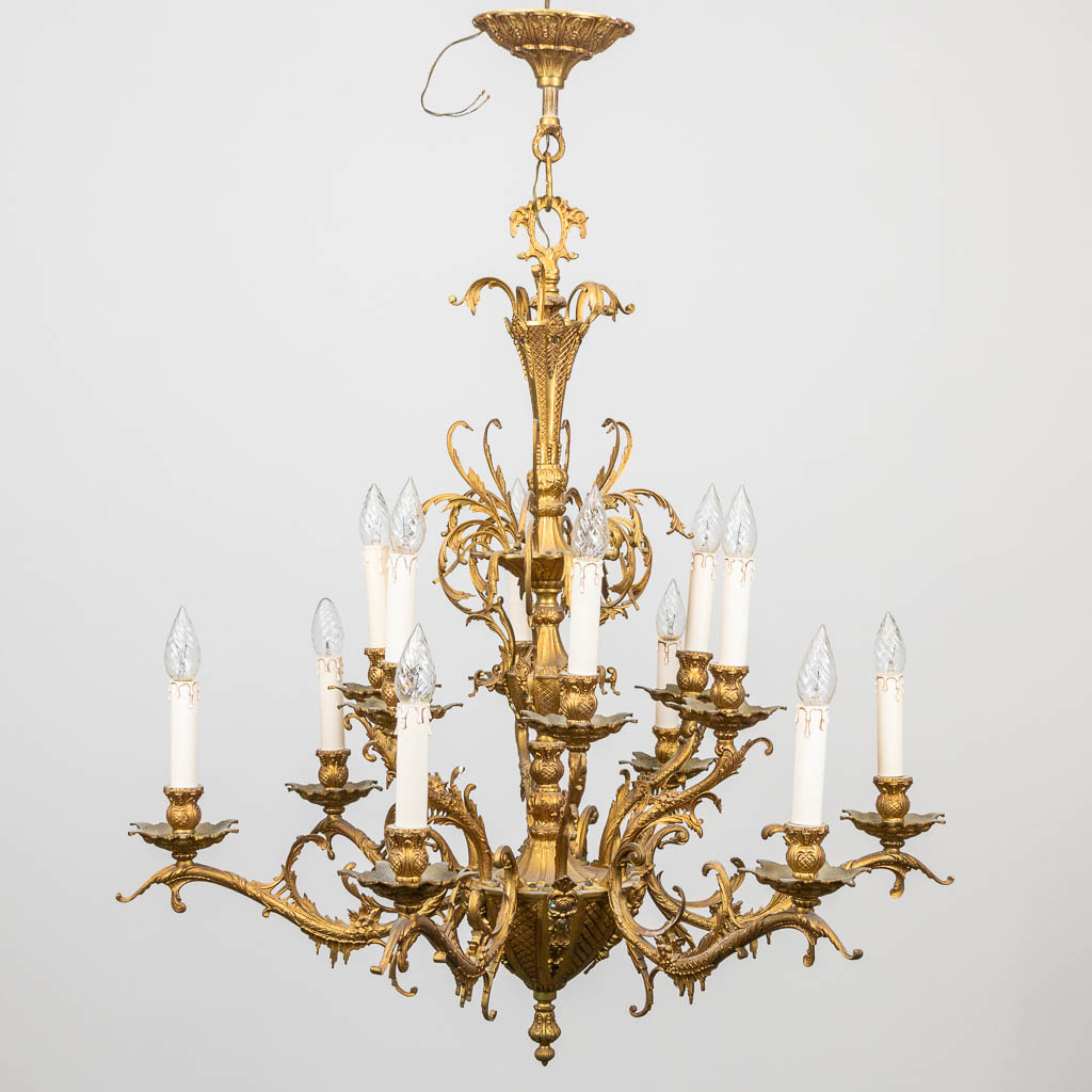 A chandelier made of bronze in 2 levels. Made around 1960-1970. 