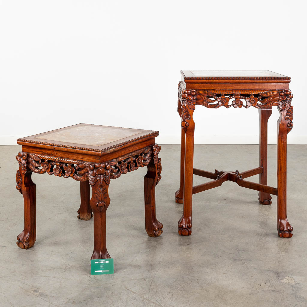 Two Oriental hardwood stands with a marble top. 20th C. (D:50 x W:50 x H:70 cm)