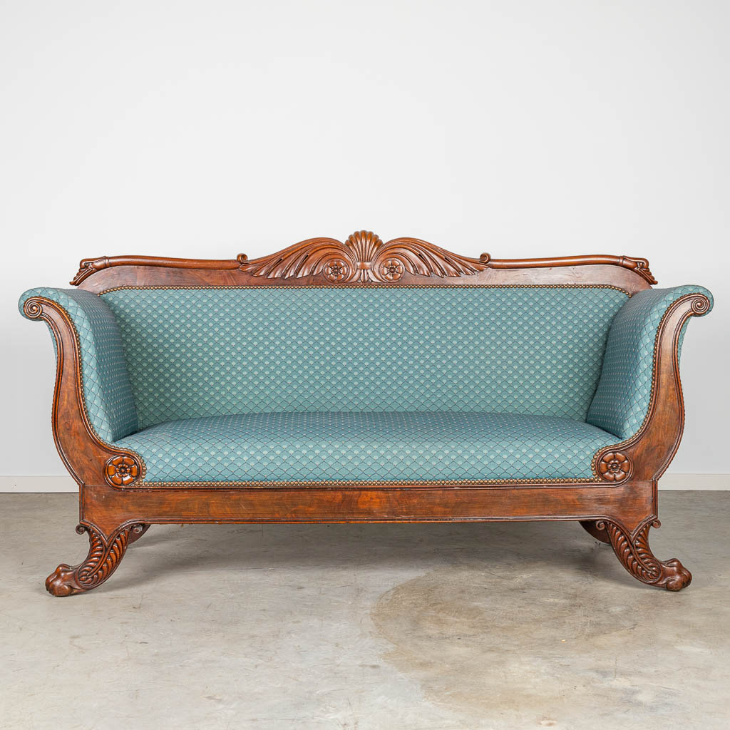 A sofa made of mahogany and finished in Louis Philippe style. 
