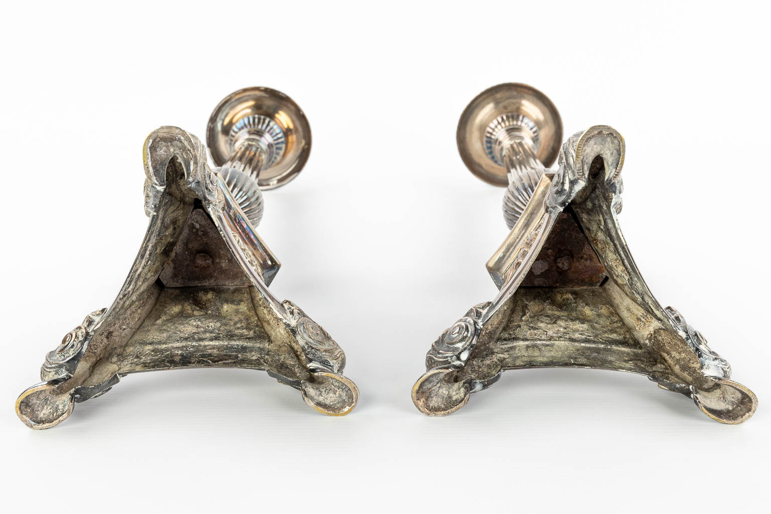 A pair of silver-plated candlesticks decorated with images of holy figurines. (H:59cm)