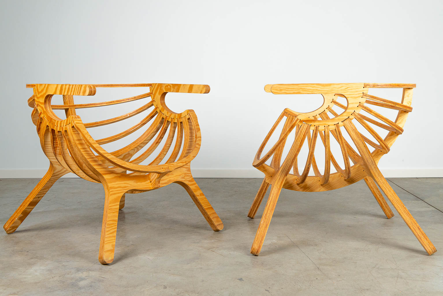 A pair of lounge chairs, made of plywood cut on the CNC machine. 21st century