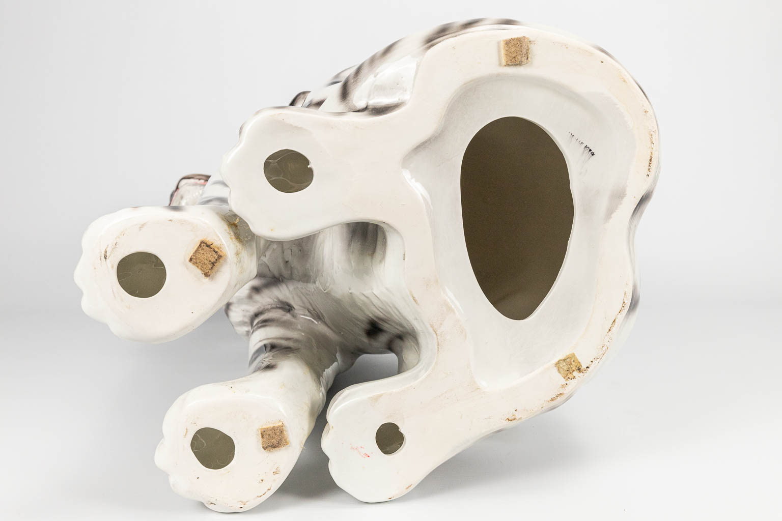 A ceramic statue of a white tiger with black stripes. Made in Italy. 