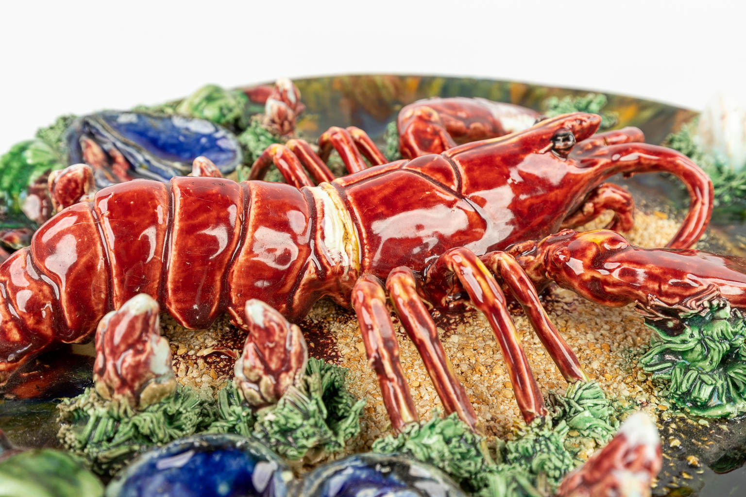 Jose Alvaro Caldas, a plate made of glazed faience, barbotine, decorated with a lobster. Suite de Palissy. 