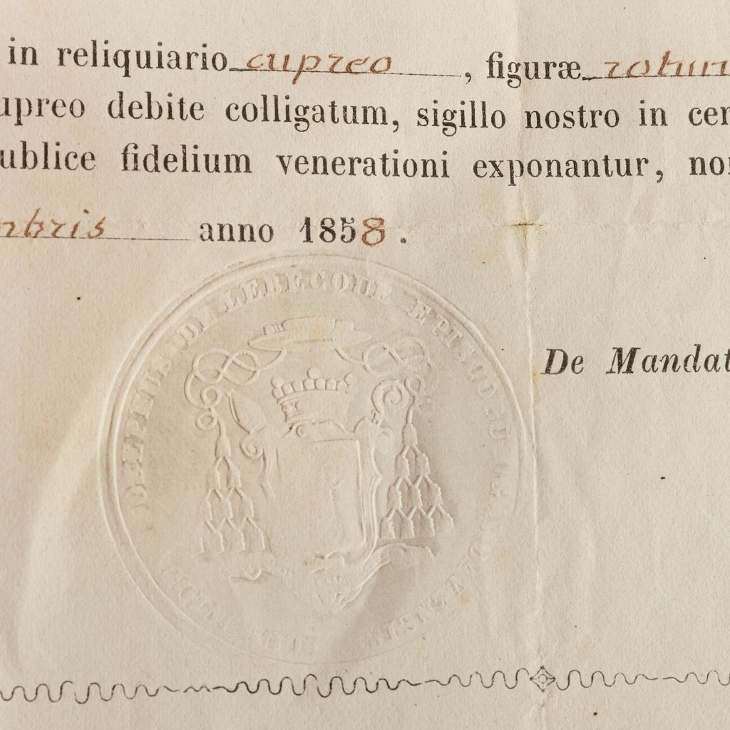A sealed theca with a relic: Ex Ossibus Sancta Domitillae Martyris