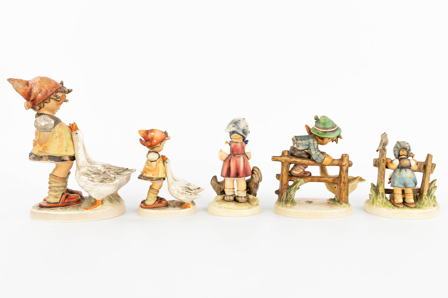 A collection of 5 statues made by Hummel. (H:20cm)