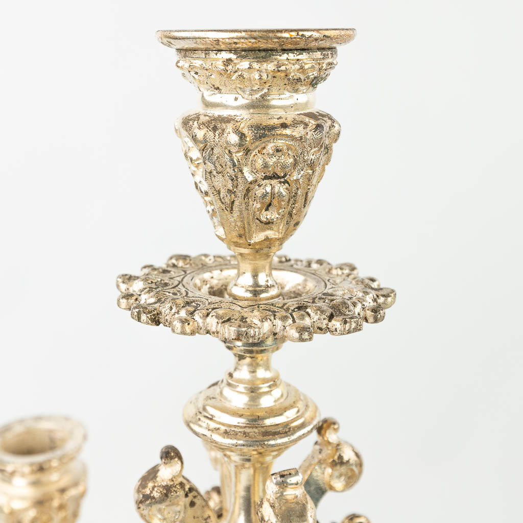 A three-piece garniture clock with candelabra, made of silver-plated bronze in gothic revival style. (H:62cm)