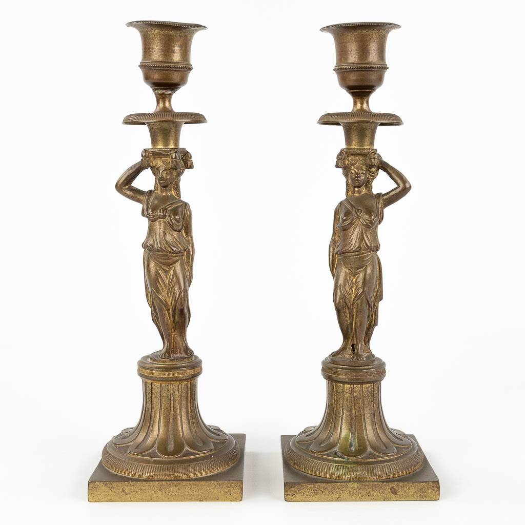  A pair of Karyatid candlesticks, bronze 19th C. 