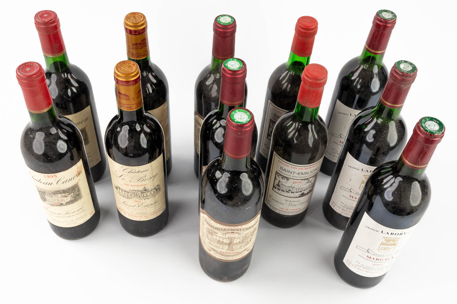 A collection of 12 bottles of wine. 1975 untill 1995.