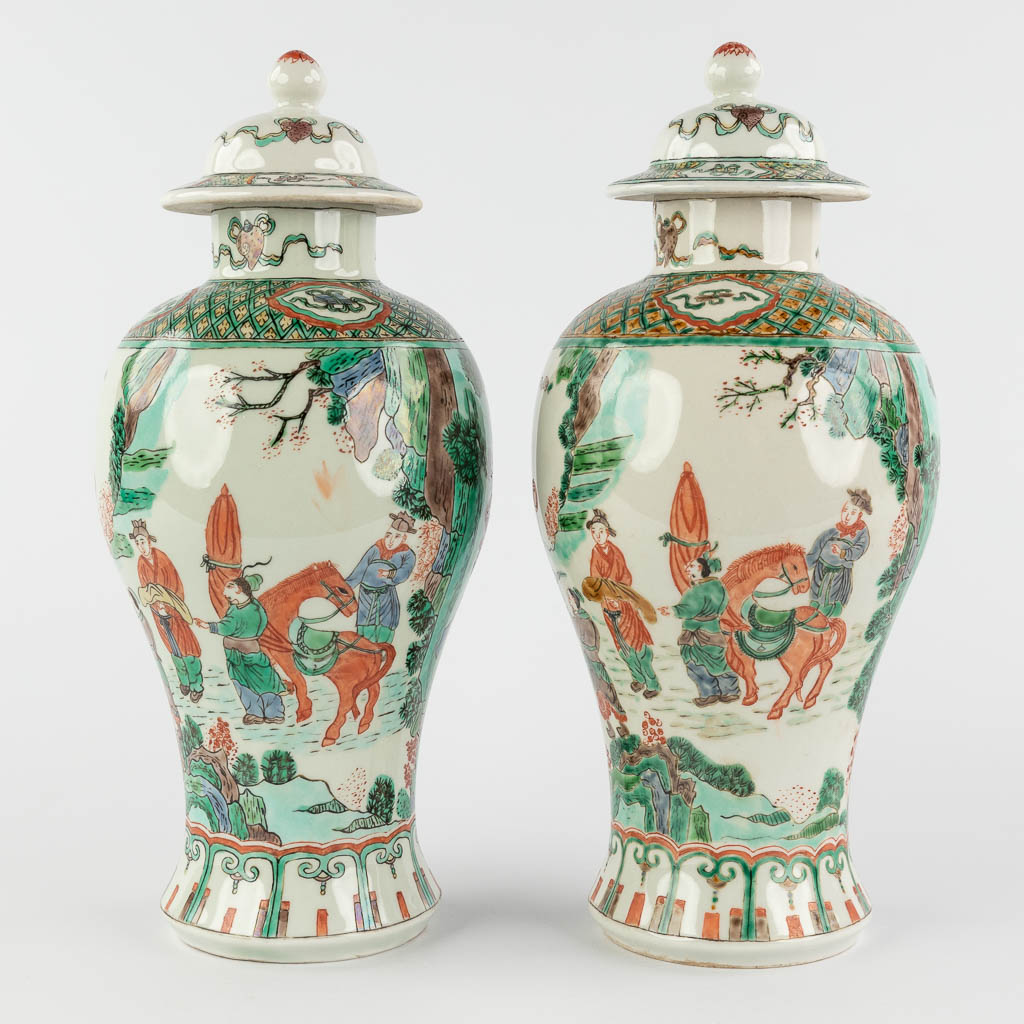 A pair of Chinese Famille Verte with farmers and symbols of happiness. 20th C. (H:29 x D:13 cm)