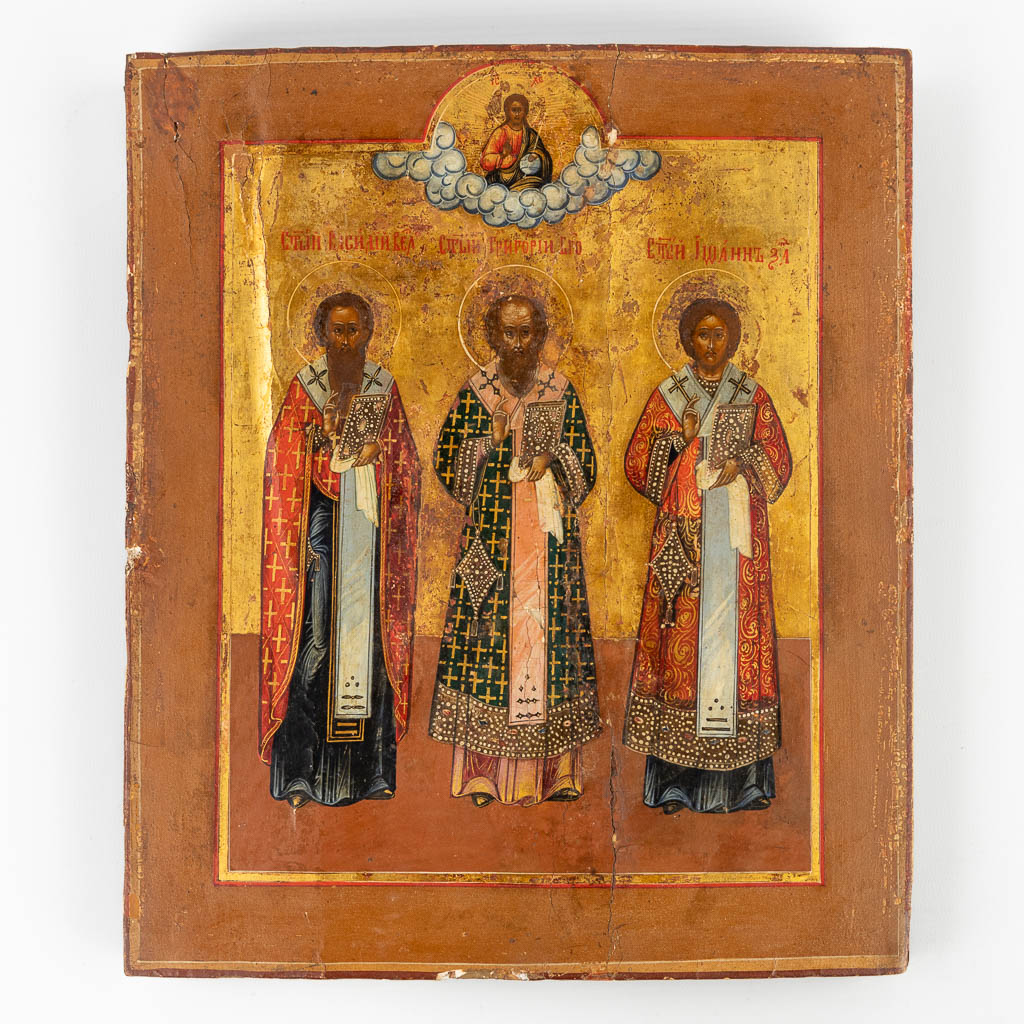 Een antieke Russische icoon 'Drie Heilige Hierarchen van Orthodox Christendom', 19de eeuw. (W:26,5 x H:31 cm)