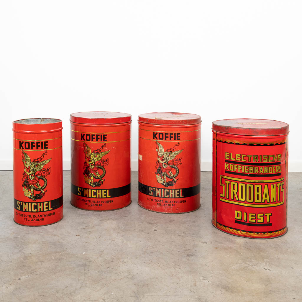 A collection of 4 large tin cans 