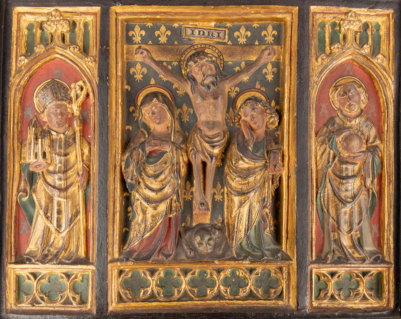 A religious Triptych made of patinated plaster in gothic revival style. 20th C. (W: 46 x H: 37 cm)