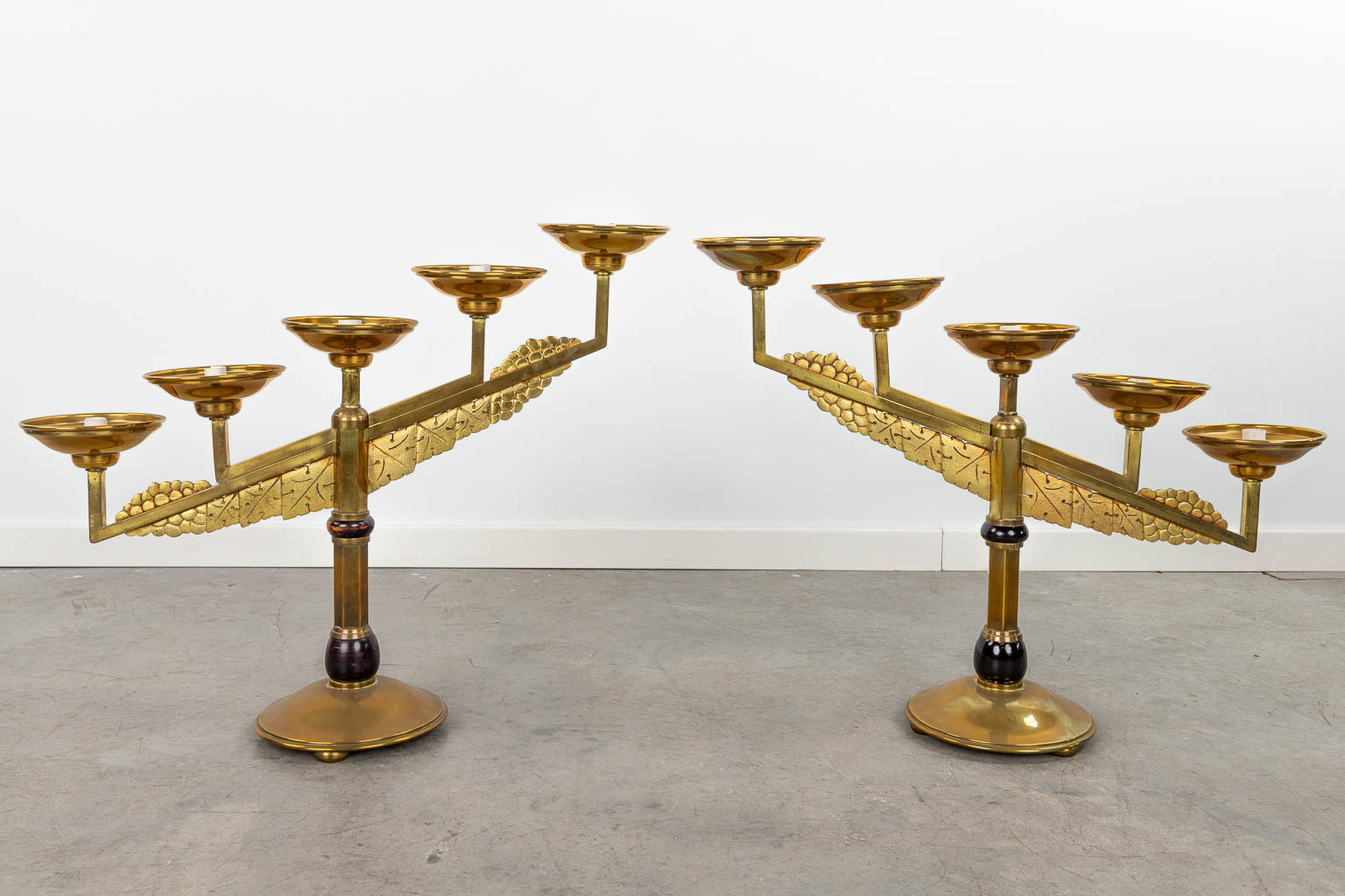 A collection of 2 pairs of candlesticks made of bronze in art deco style. (H:53cm)