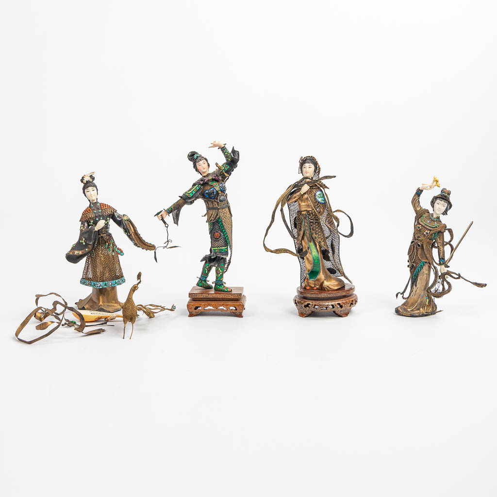A collection of 4 figurines with weapons and music instruments, made of silver and finished with filigrana, cloisonné enamel, c