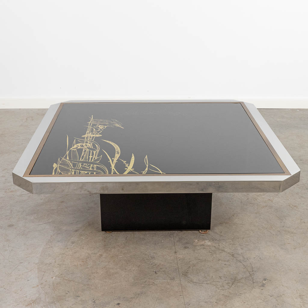 A coffee table made of glass and metal finished with a King Fisher and made by Belgo Chrom. (H:34cm)