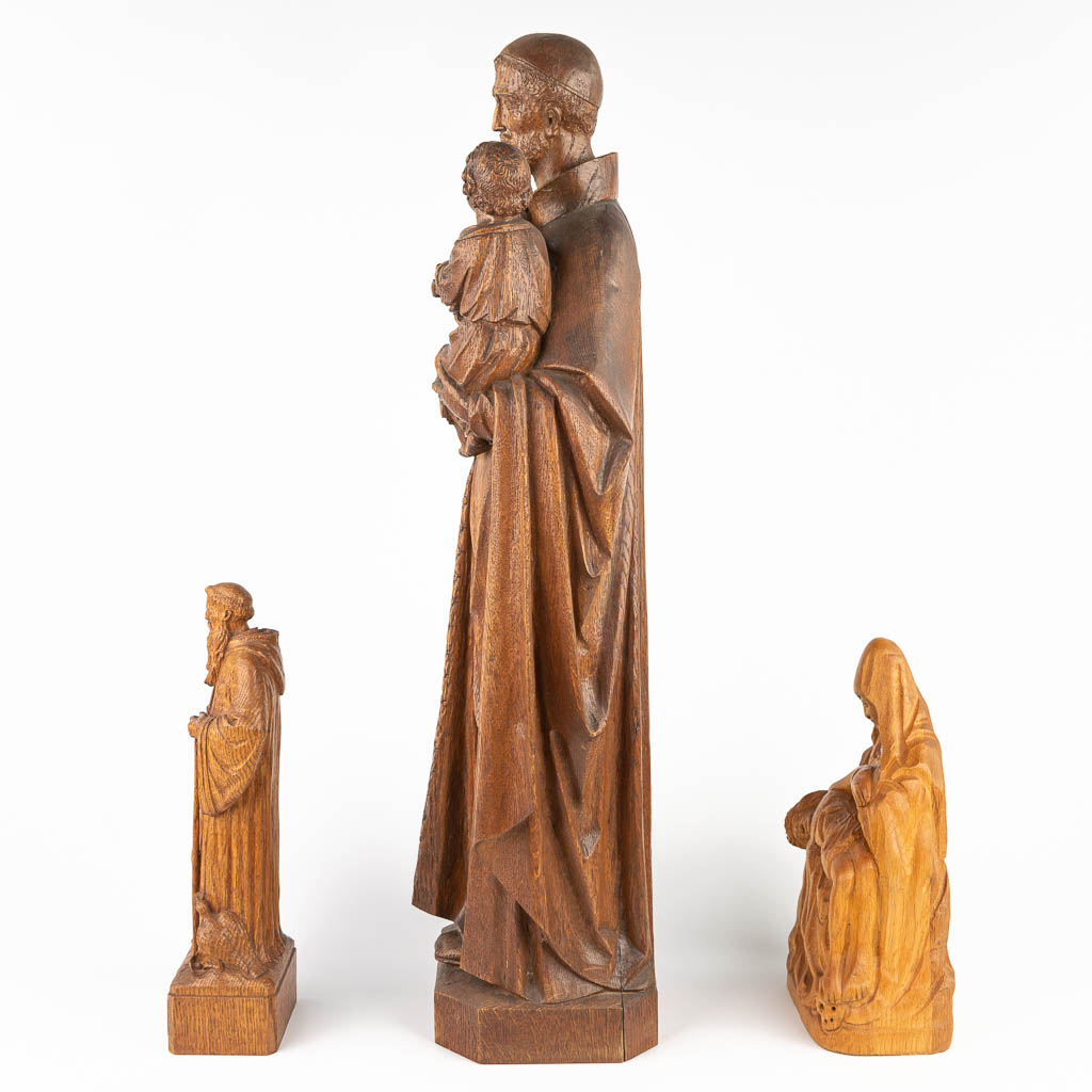A collection of 3 statues of holy figurines made of sculptured wood. (H:78cm)