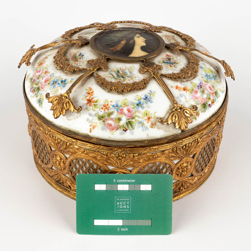 A porcelain Jewelry box, porcelain mounted with bronze. hand-painted flower decor. (H:12 x D:21 cm)