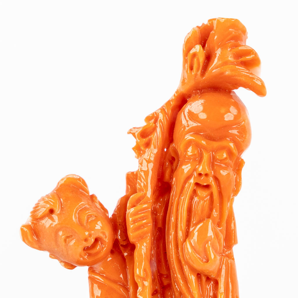 A Chinese coral figurine of Shoulao, 23g. (H:8,5 cm)