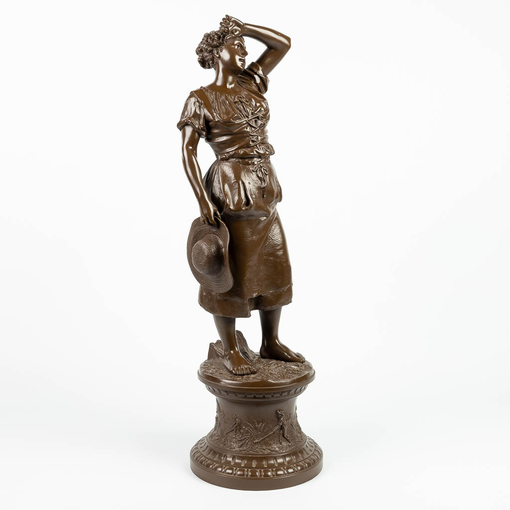 A statue of a lady, made of spelter. 20th century. (H:79cm)