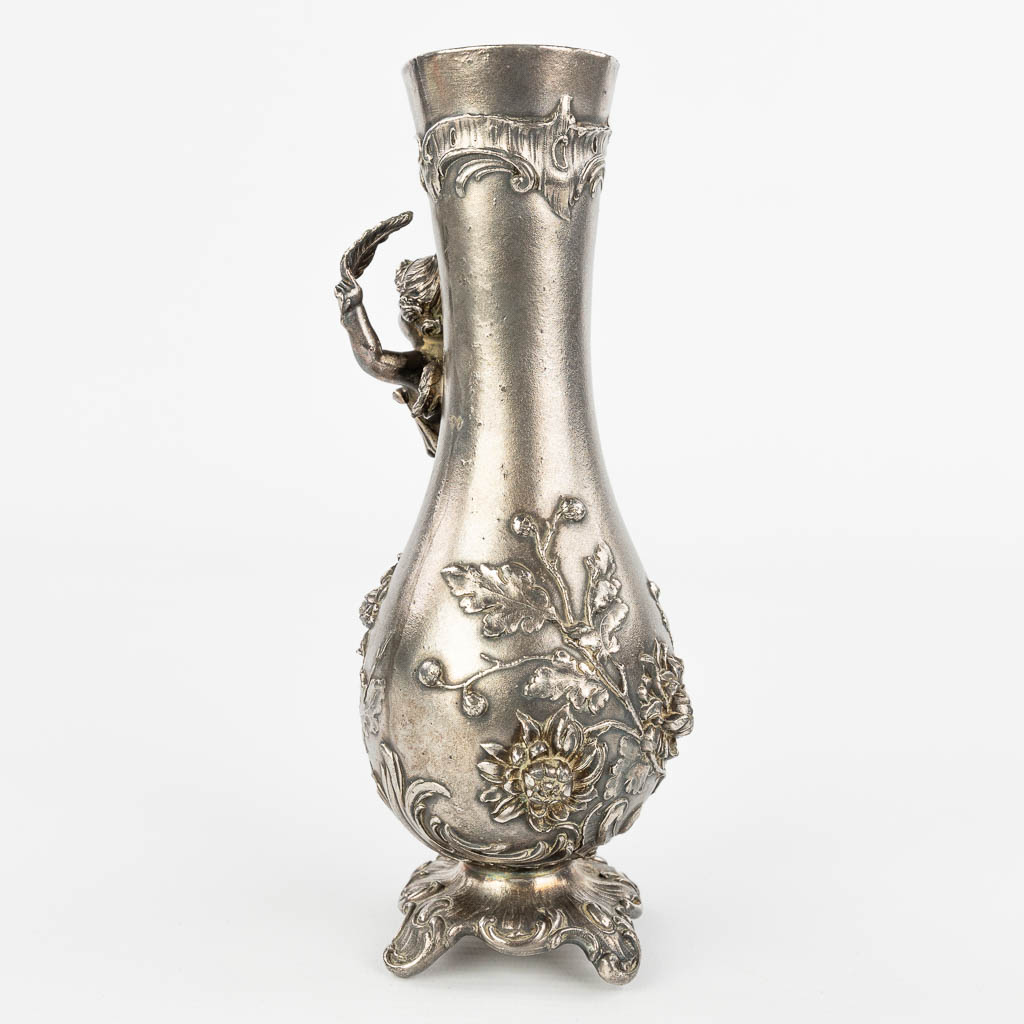 A vase decorated with putti and made of silver-plated metal in art nouveau style. Marked WMF. (H:19cm)