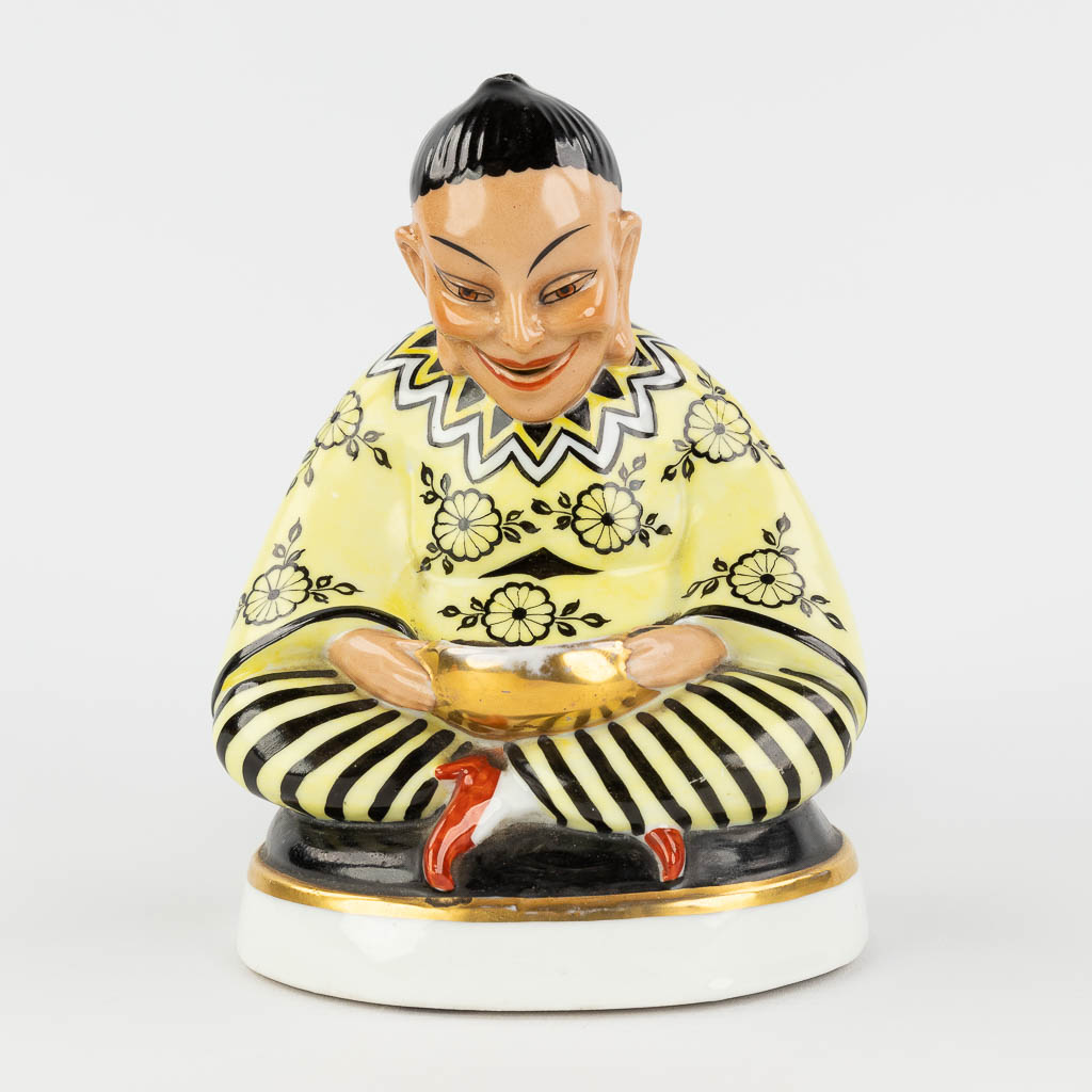 An insence burner in the shape of a Chinese figurine, interior with a lamp. Circa 1920. 