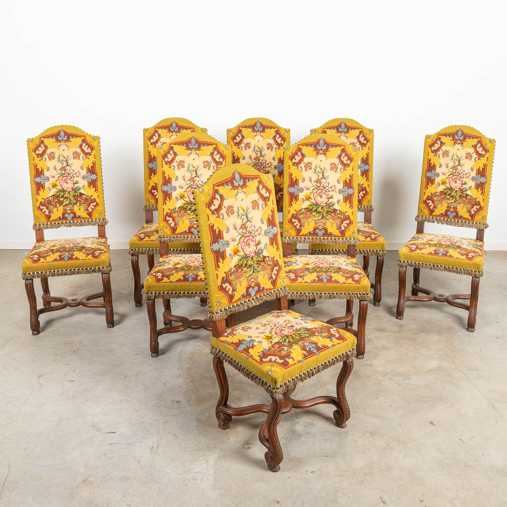 A set of 8 Os De Mouton chairs with embroidered fabric. 